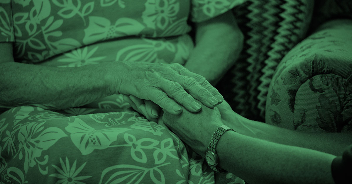 Holding hands with a patient